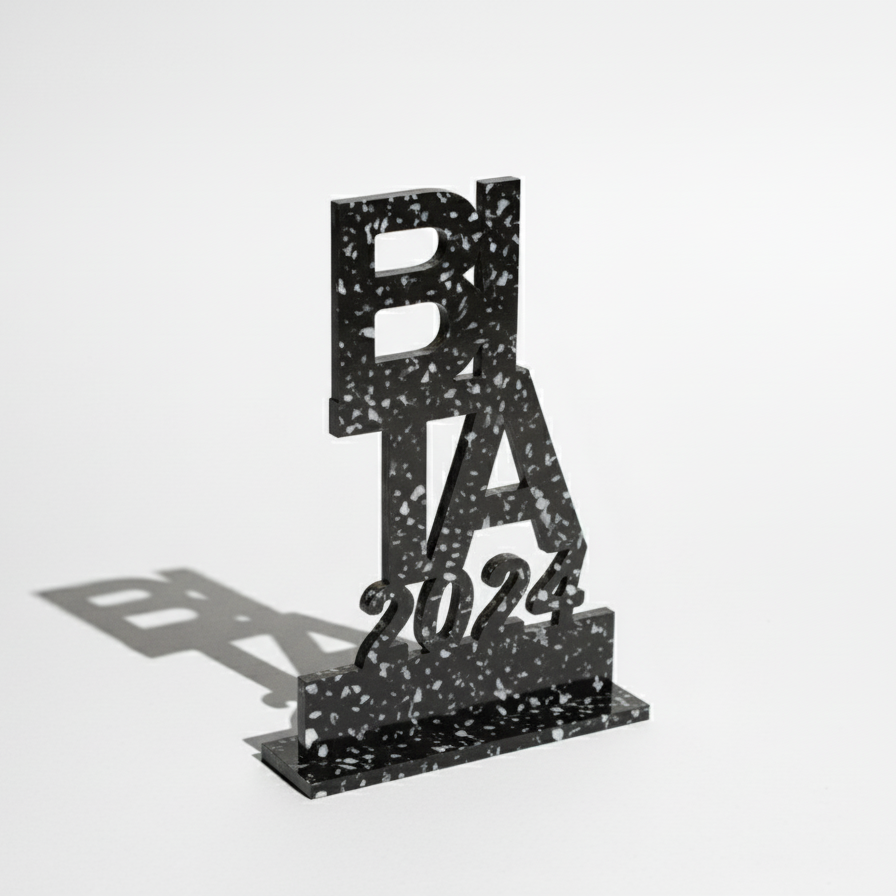 galvano-plastico-reciclado-negro-revivir-2025 galvano de plástico reciclado con textura terrazo. El mejor regalo corporativo 2025